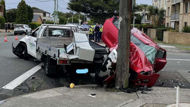 Four people in the Swift were hospitalised while the two men in the utility escaped injury following the collision on Denison St, Hamilton. Picture: Dan Proudman