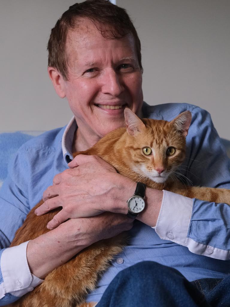 Lucky Pete with his new owner Shane Donoghue. Picture: Mark Wilson