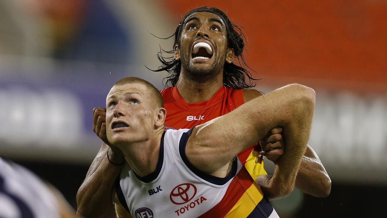 Gold Coast Suns' Tom Nicholls and Adelaide's Sam Jacobs in action.