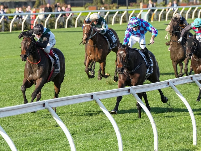 Mr Brightside (black cap) storms home to grab Pride Of Jenni and win the Makybe Diva Stakes at Flemington on Saturday. Photo: George Sal/Getty Images.