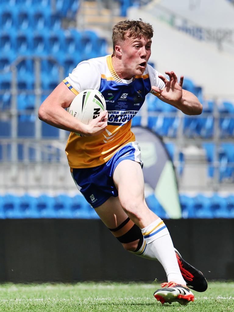 NRL National Schoolboys Cup final at CBUS Stadium between Palm Beach Currumbin and Patrician Blacktown Brothers. Patrician Blacktown Brothers Jhett Sydir chased by PBCs Isaac Harrison. .Picture Glenn Hampson