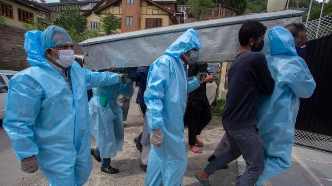 Relatives carry the body of a Covid victim in Srinagar. Picture: AFP.