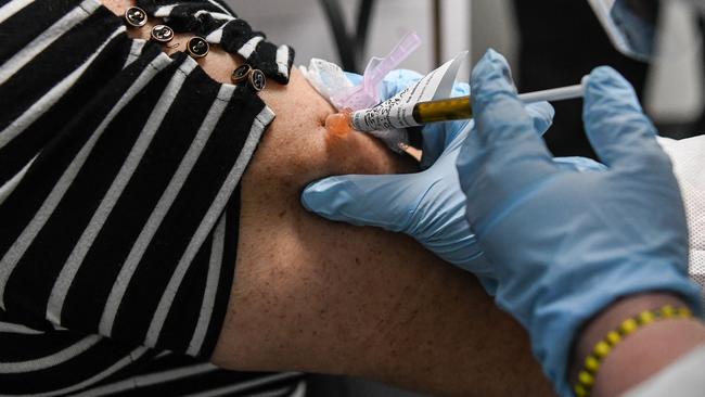 A woman receives a COVID-19 vaccination at the Research Centers of America in the United States. Picture: Chandan Khanna/AFP