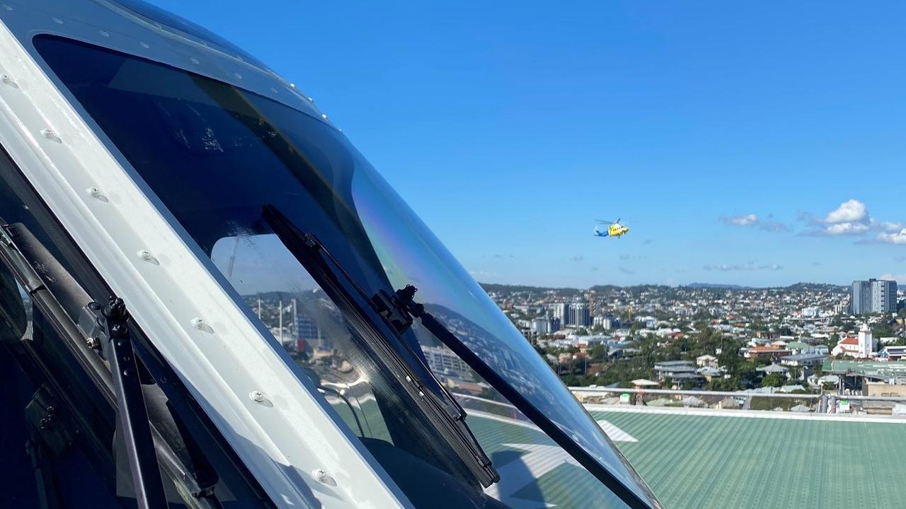 ARRIVING: The LifeFlight crew arrived at the Queensland Children's Hospital on Thursday morning with the 11-year-old Dalby victim.