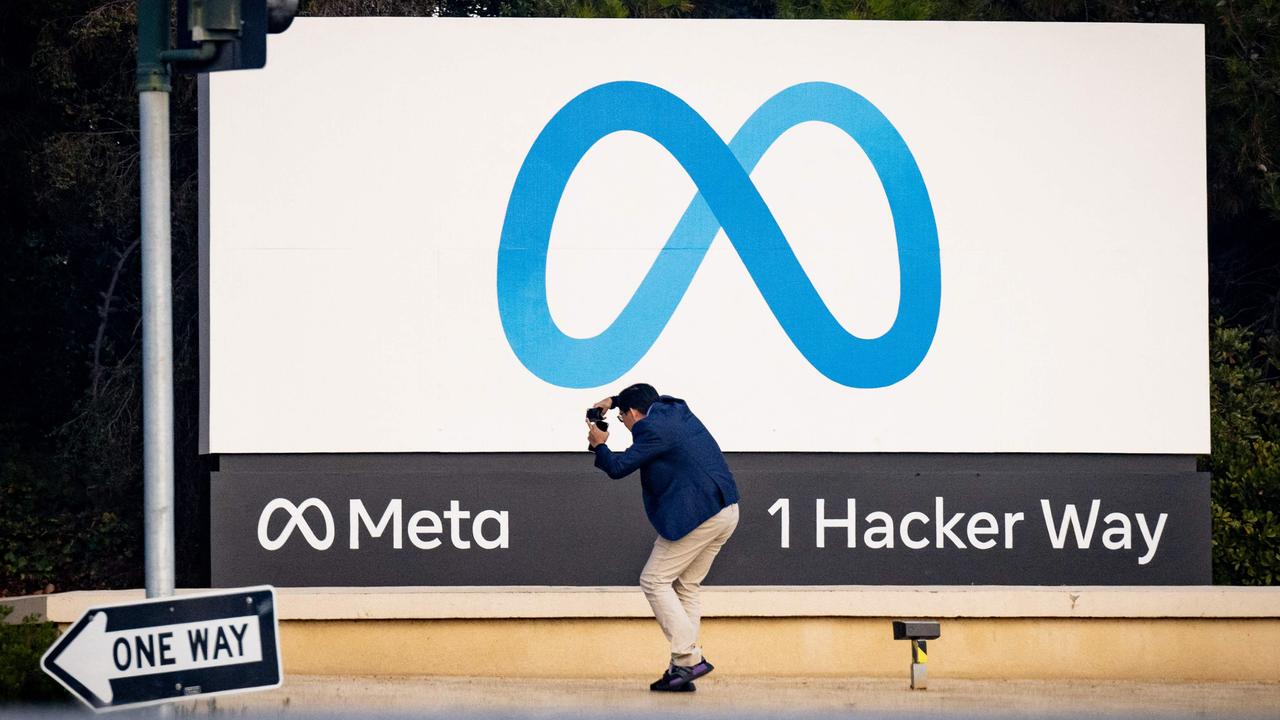 A man takes a photo at Meta corporate headquarters in Menlo Park, California. Picture: Josh Edelson / AFP