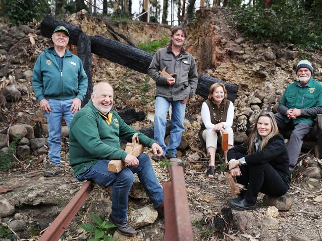 In the NSW town of Mogo, a grant of $25,000 will be given to the “Eurobodalla Woodies” who lost their workshop and tools in the December fires. Sharyn Morrison, Barry Fenning, Helmut Delrieux, David Smith, Nick Stone and Ann Salmon are pictured at the site.