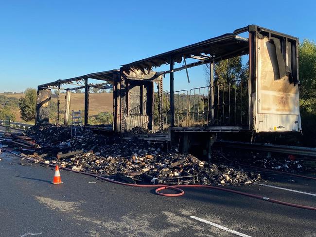 A truck transporting toilet paper caught fire on the Western Freeway on Wednesday morning. Picture: Department of Transport