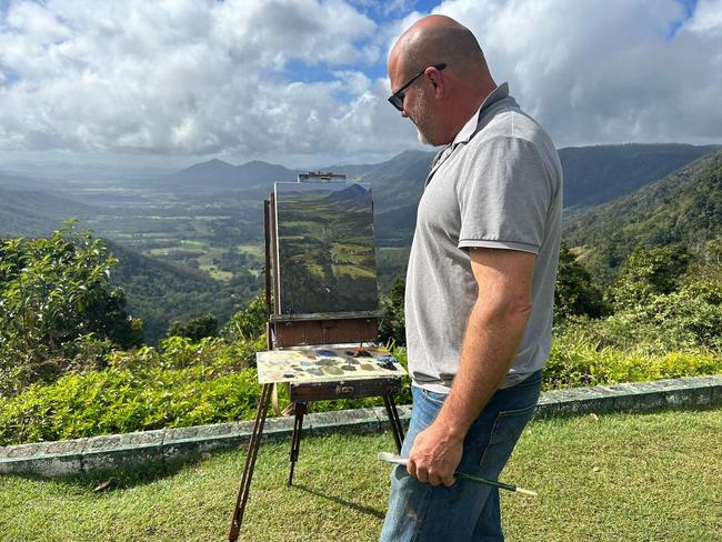 Milton House Gallery owner and artist Bradley Short painting 'Plein Air Study Eungella', which won Overall Winner at the Woollam Art on Show Awards 2024 as selected by HOTA director Susi Muddiman.