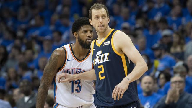 Utah’s Joe Ingles defends against Oklahoma City Thunder’s Paul George at the Chesapeake Energy Arena yesterday