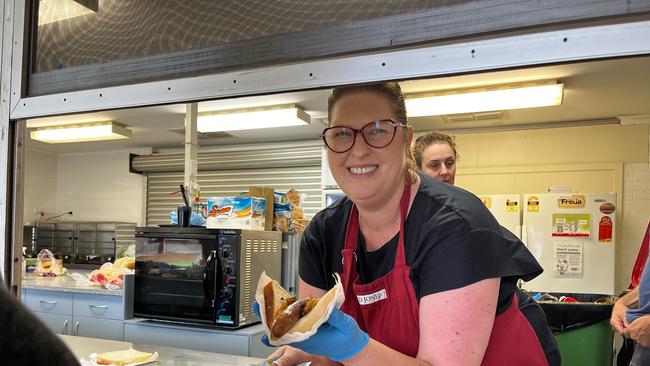 Janine serves democracy sausages at Queanbeyan Public School. Picture Julia Kanapathippillai