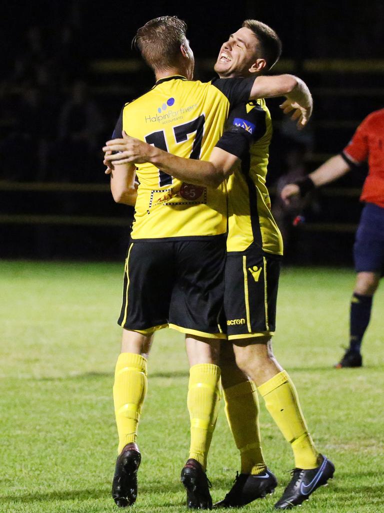 Tigers' Josh Taylor hugs his team mate Aaron Bull after he scored a goal off a header in the FNQ Football Premiership match between the Edge Hill Tigers and the Marlin Coast Rangers, held at Tiger Park, Manunda. Picture: Brendan Radke