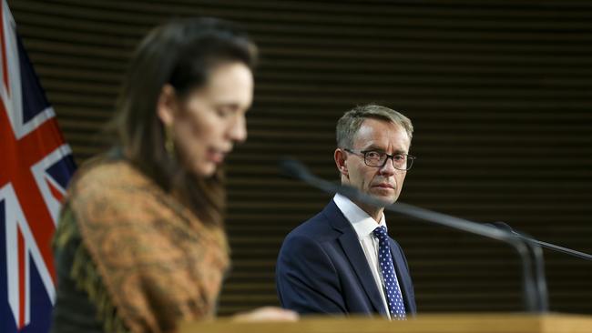 New Zealand’s Director-General of Health Dr Ashley Bloomfield looks on while Prime Minister Jacinda Ardern speaks to the media. Picture: Getty