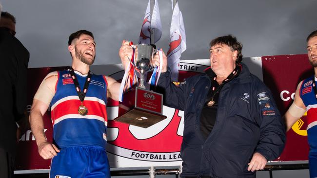 Keilor captain Kane Barbuto and coach Mick McGuane hoist the silverware. Picture: Jamie Morey