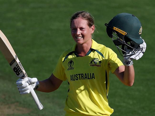 Australia's captain Meg Lanning celebrates after reaching her century (100 runs) during the Women's Cricket World Cup match between Australia and South Africa at the Basin Reserve in Wellington on March 22, 2022. (Photo by Marty MELVILLE / AFP)