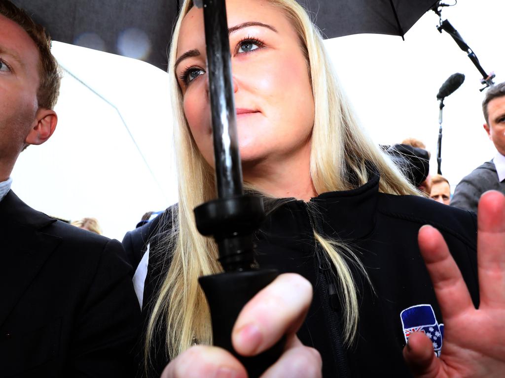 Ms Whelan rushed to a waiting car to avoid questions from the travelling media pack. Picture: Gary Ramage