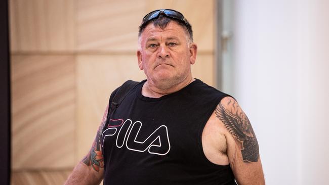 Harry Garside’s father Shaun Garside walking through Sydney airport alone after police took his son for questioning. Picture: Julian Andrews