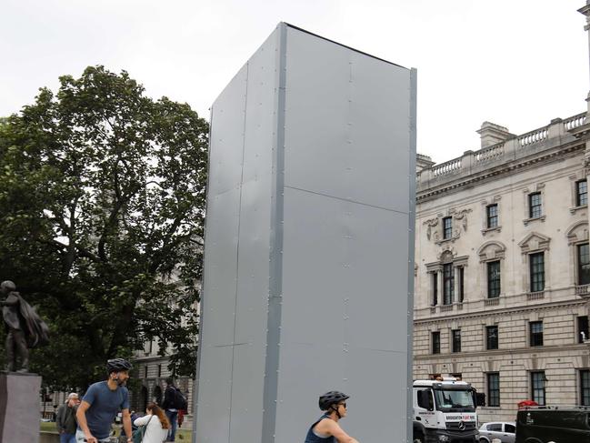 A statue of British wartime Prime Minister Winston Churchill is boarded up on Parliament square in central London on June 12, 2020. - Authorities in London boarded up memorials including a statue of British wartime leader Winston Churchill on Friday amid fears of clashes between anti-racism protesters and far-right groups. (Photo by Tolga AKMEN / AFP)