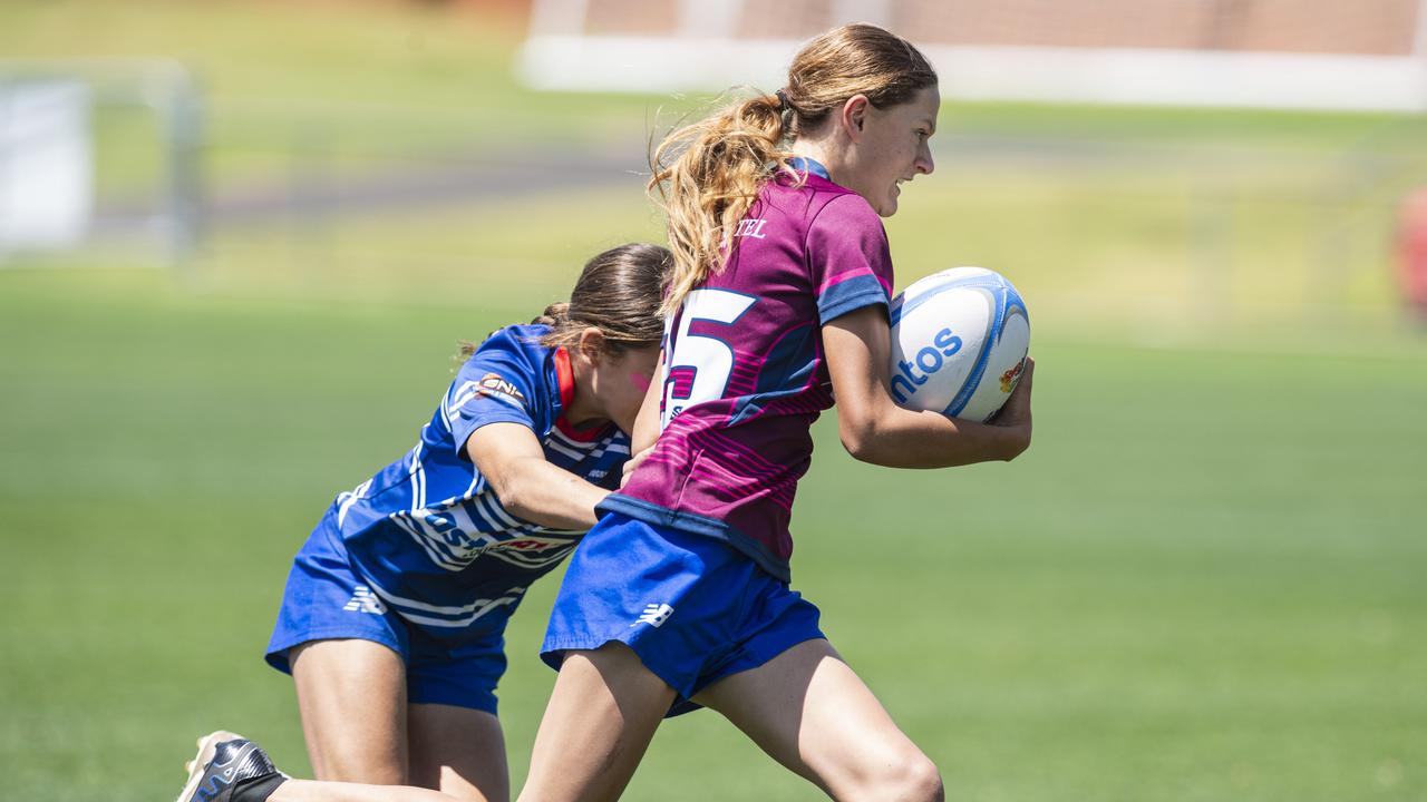 Tess Yeomans of Bears on the move against University in a club game as Downs Rugby host Next Gen 7s at Toowoomba Sports Ground, Saturday, October 12, 2024. Picture: Kevin Farmer