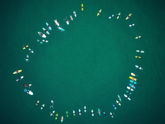 Friends farewelled Nick Slater during a paddle out in Newcastle. Picture: Matt Richards