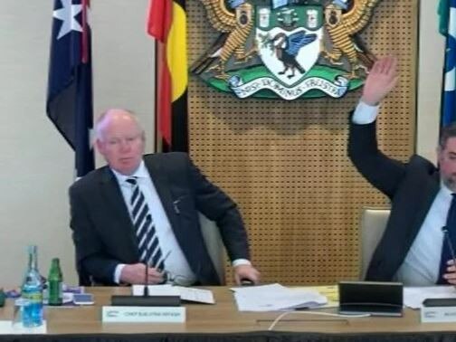 Liverpool Mayor Ned Mannoun (right) voting in favour of his motion alongside acting chief executive Jason Brenton on Monday.