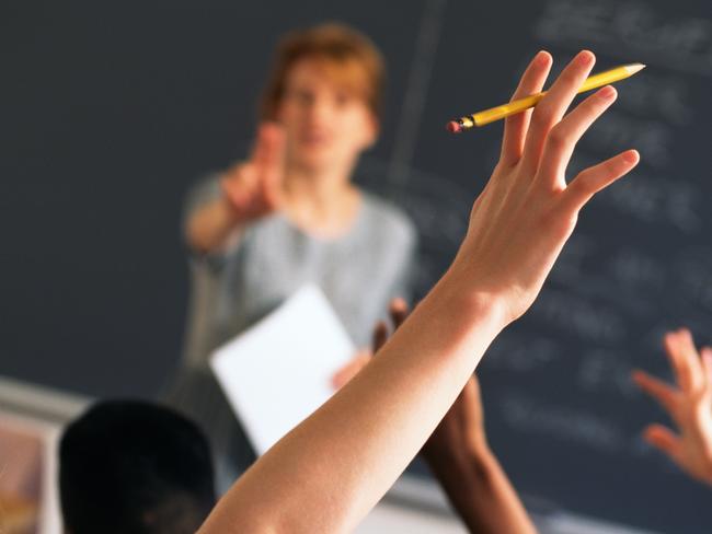 Teacher pointing to raised hands in classroom, Classroom, teaching generic, education generic, Teacher, Learning, Hand Raised, Education, Adult, School Building, Pointing, Standing, Image, Women, Adults Only, Colour Image, Horizontal, Human Arm, Human Body Part, Human Limb, Incidental People, Indoors, Limb, One Person, Only Women, People, Photography, thinkstock, generic, istock