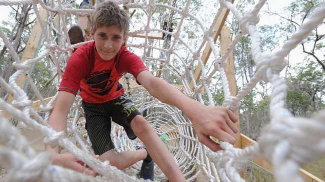 Sydney Scholes from Perth makes his way through the ropes maze at the 2013 Australian Scout Jamboree. Picture: Alistair Brightman