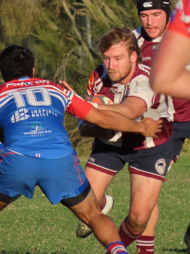 Noosa Dolphins A Grade captain, Nick Colvin, taking a hit up in a match against Wynnum.