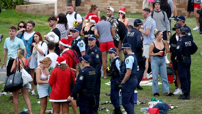 A crowd of mostly backpackers hold an impromptu party at Bronte Beach on Christmas Day with police in attendance to move the large crowd on. Picture: Toby Zerna