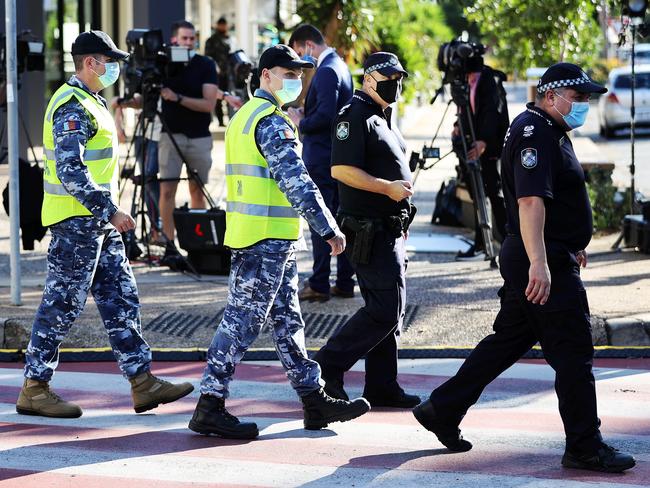 Police and army personnel at the Queensland border in Griffith St, Coolangatta. Picture: Nigel Hallett