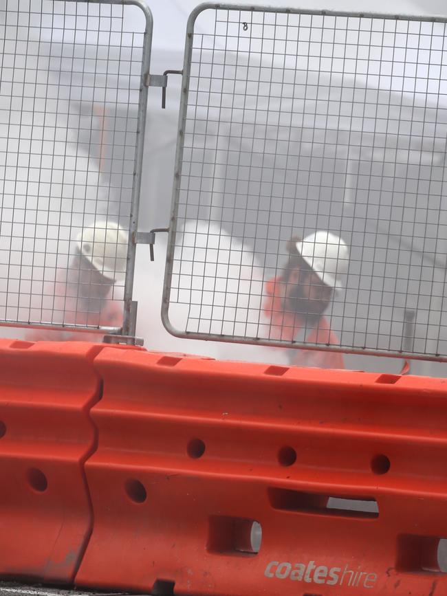 Workers on the light rail opposite Town Hall were engulfed in smoke. Picture: John Grainger