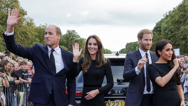 Prince William, Catherine, Princess of Wales, Prince Harry and Meghan wave at wellwishers on the Long walk at Windsor Castle. Picture: AFP.