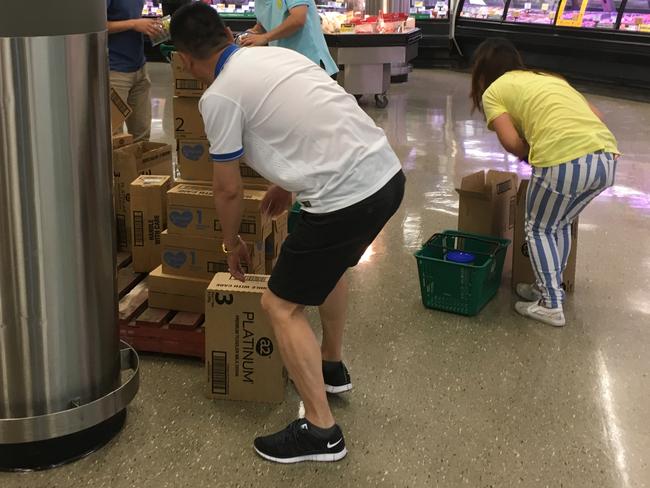 A “baby formula gang” in action in Woolworths at Westfield Burwood.