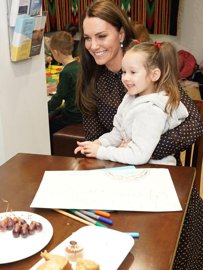 The royal with five-year-old Zlata Yeromenko. Picture: AFP