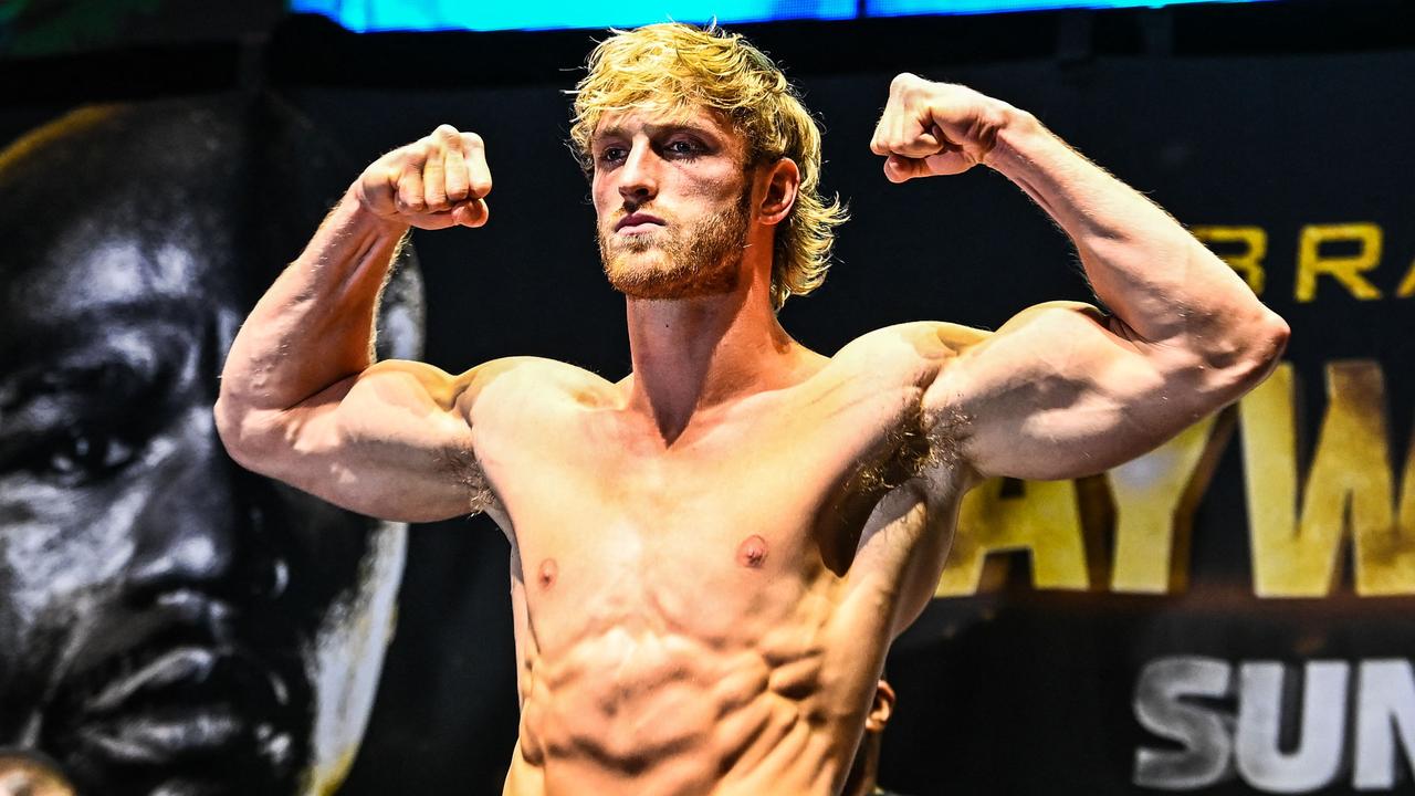 YouTube personality Logan Paul gestures during his weigh-in event. (Photo by CHANDAN KHANNA / AFP)
