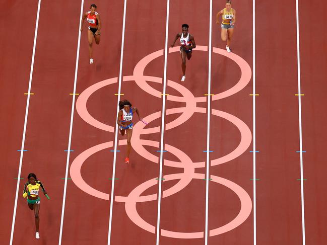 TOKYO, JAPAN - AUGUST 06: Shericka Jackson of Team Jamaica finishes ahead of Gabrielle Thomas of Team United States to win the gold medal in the Women's 4 x 100m Relay Final on day fourteen of the Tokyo 2020 Olympic Games at Olympic Stadium on August 06, 2021 in Tokyo, Japan. (Photo by Richard Heathcote/Getty Images)