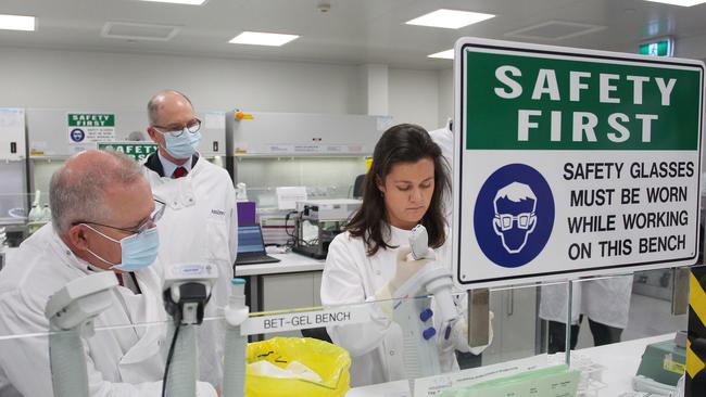 Prime Minister Scott Morrison meets team member Savannah Alegre at the microbiology laboratory at vaccine developer AstraZeneca in Sydney in August. Picture: Pool/Getty Images