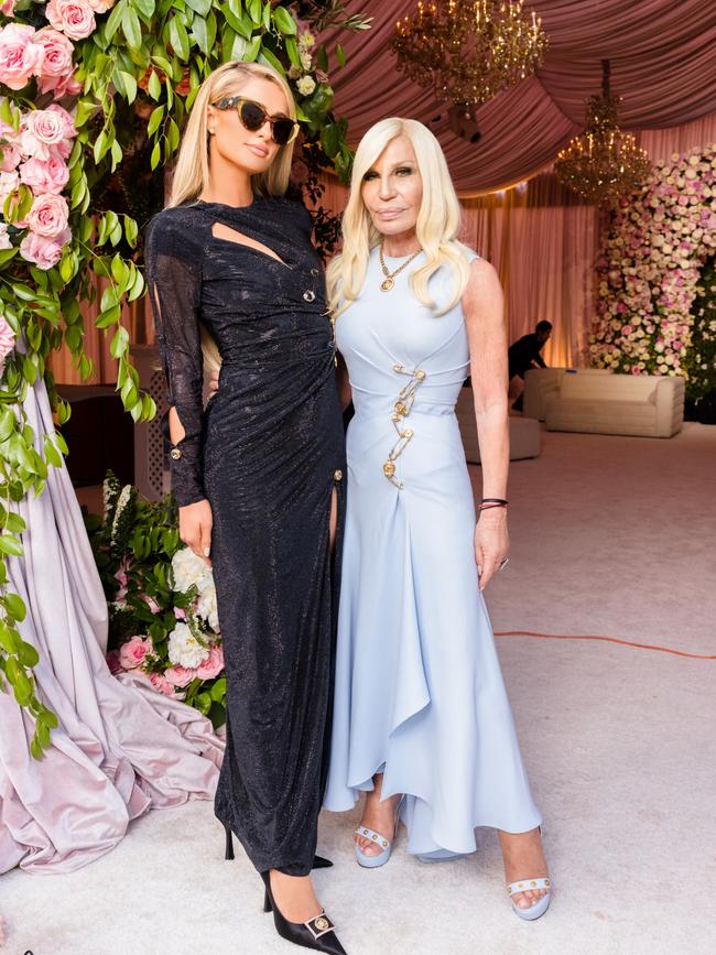 The bride’s dress was custom-made by designer Donatella Versace, who was also a guest at the wedding, where she is seen posing with Paris Hilton, who also donned a Versace ensemble. Picture: Kevin Ostajewski/Shutterstock/MEDIA MODE.