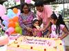 BILOELA, AUSTRALIA - JUNE 12:  Tharnicaa Nadesalingam celebrates her fifth birthday with her parents Priya and Nades and her sister Kopika on June 12, 2022 in Biloela, Australia. Four years ago, the Nadesalingam family, a Sri Lankan couple seeking asylum and their two Australian-born children, were removed from their home in central Queensland by the Australian Border Force and taken to immigration detention when their immigration protection visas expired. After a multi-year campaign led by members of the central Queensland community of Biloela, the incoming Labor government has released the family from detention, permitting them to return to live and work and Biloela on a bridging visa.  (Photo by Dan Peled/Getty Images)