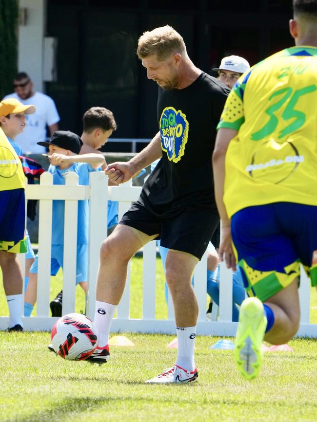 Three-time world surfing champion Mick Fanning played in the Joga Bonito Tour with former Brazilian football superstar Ronaldinho and Australia's greatest player Tim Cahill (pictured) at Merrimac Football Club. Picture: Nathan Richter