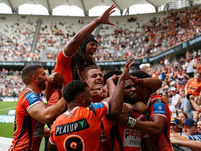 Wests Tigers' Jarome Luai and Sunia Turuva bring out the claw celebration.