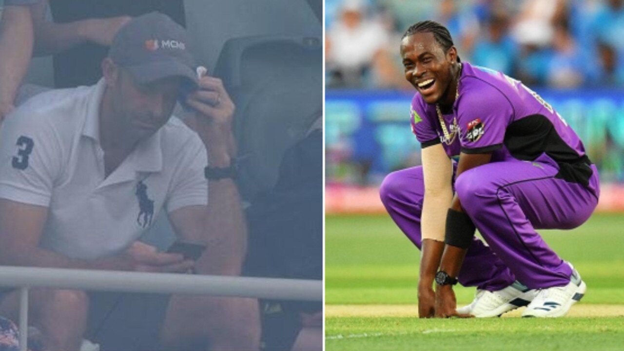 The sore spectator nurses his head, and Jofra Archer celebrates a wicket.