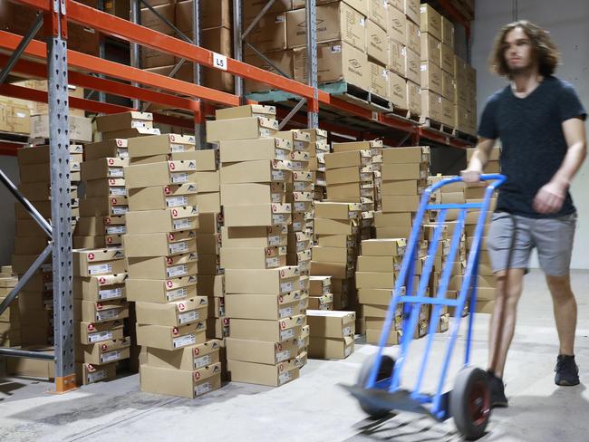 Warehouse staff at Ascent Shoes in Virginia, Brisbane on Wednesday, March 27, 2019. (AAP image/Claudia Baxter)