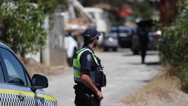 Police at a scene on Morrow Road in Lonsdale as part of the investigation into the suspected murder of Jeff Mundy. Picture: David Mariuz