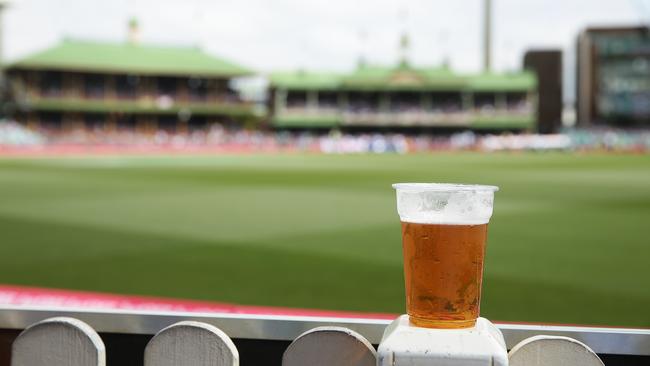 A beer sits on the fence during Day 1 of the 4th Test match between Australia and India at the SCG. Picture: Brett Costello