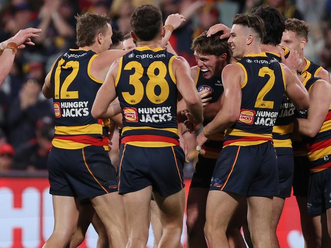 ADELAIDE, AUSTRALIA – AUG 11: Daniel Curtin of the Crows celebrates a goal during the 2024 AFL Round 22 match between the Adelaide Crows and the Western Bulldogs at Adelaide Oval on August 11, 2024 in Adelaide, Australia. (Photo by James Elsby/AFL Photos via Getty Images)