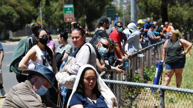 People are seen queuing up at the Parafield Gardens COVID testing centre on November 17, 2020 in Adelaide, South Australia. (Photo by David Mariuz/Getty Images)