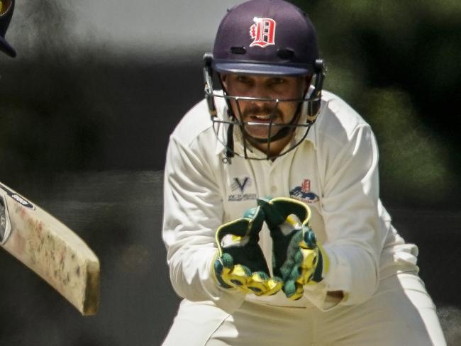 Premier Cricket: Dandenong v Kingston Hawthorn. Sam Newell (Kingston) and Dandenong keeper Jacques Augustin. Picture: Valeriu Campan