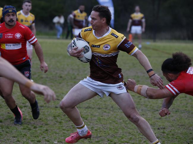 Cambo fullback Reece Lipowicz stretches out. Photographer: Warren Gannon Photography