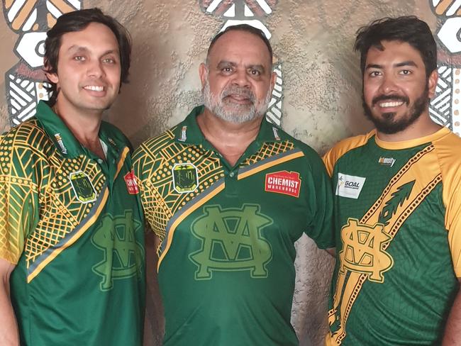 St Mary's vice-presidnet Marius Clarke, Essendon and St Mary's legend Michael Long and Premier League captain Shannon Rioli  in front of Lulu Coombes' Tiwi artwork at the renovated Saints  clubhouse. Picture: Grey Morris