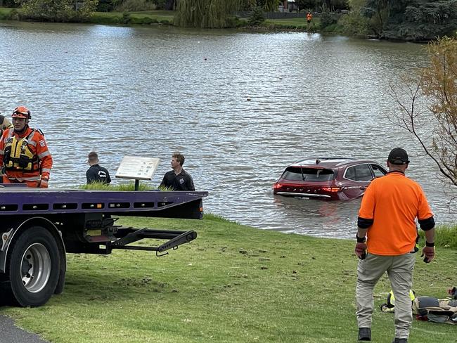 A car has driven straight into a lake in Bendigo this afternoon, with emergency crews led by the SES on scene rescuing those inside. Picture: Gianni Francis